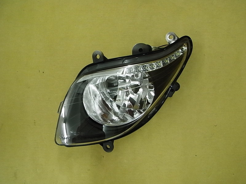 Модуль головного света левый SYM